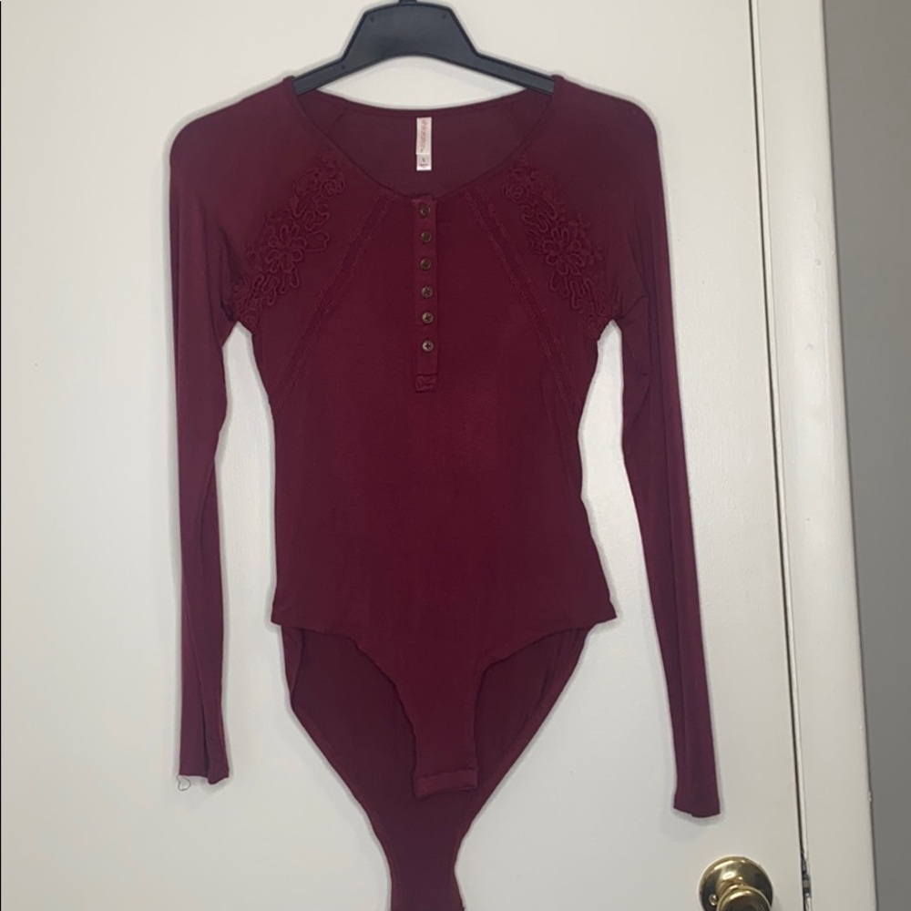 Burgundy Xhiliration body suit long sleeved small
